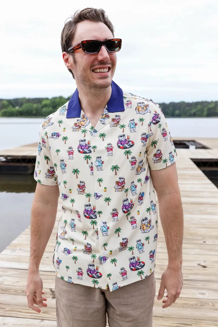 A man laughing on a dock in the Getting Tail shirt